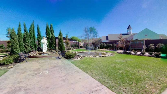 Landscaped garden with statue