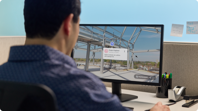 Man working on a digital twin on a computer